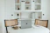A cozy workspace with a minimalist desk and a laptop displaying the épure website.