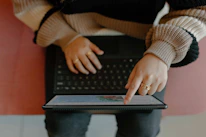 A user interacting with the tâlcymru web app on a tablet at home.