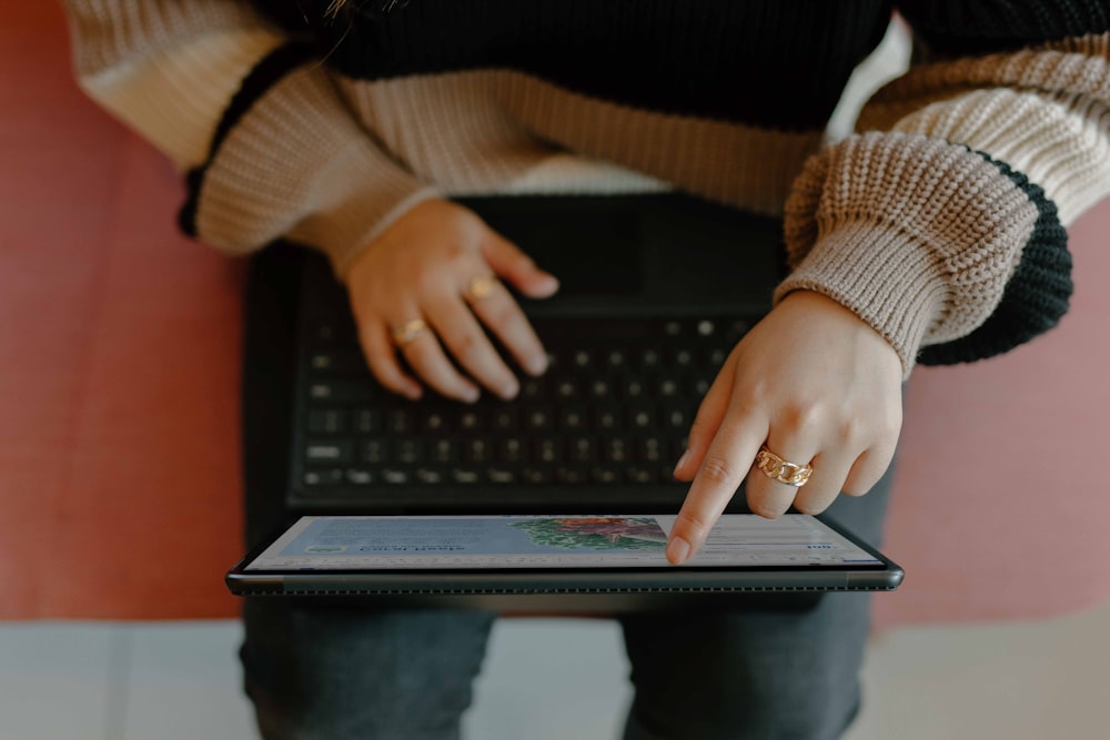 a person typing on a laptop