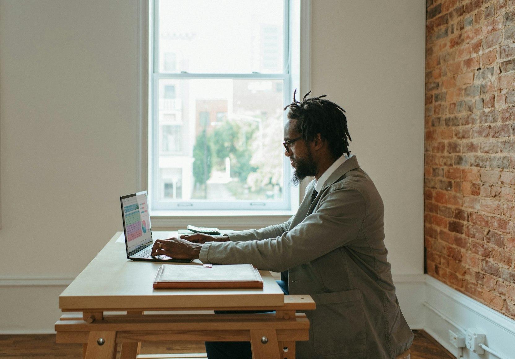 stock image of a man working in front of a computer 