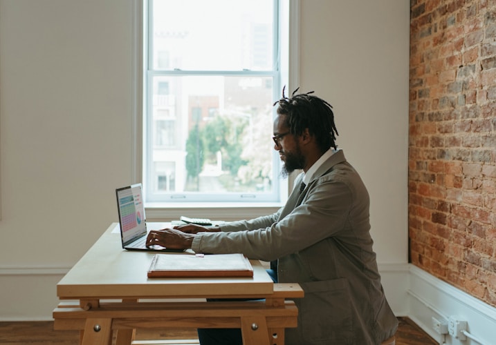 Business owner using digital accounting software on a modern laptop