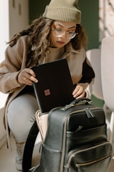 a woman holding a piece of luggage