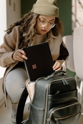 a woman holding a piece of luggage