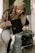 a woman holding a piece of luggage