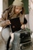 a woman holding a piece of luggage