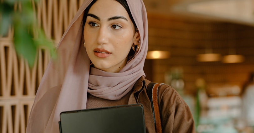 a person holding a laptop