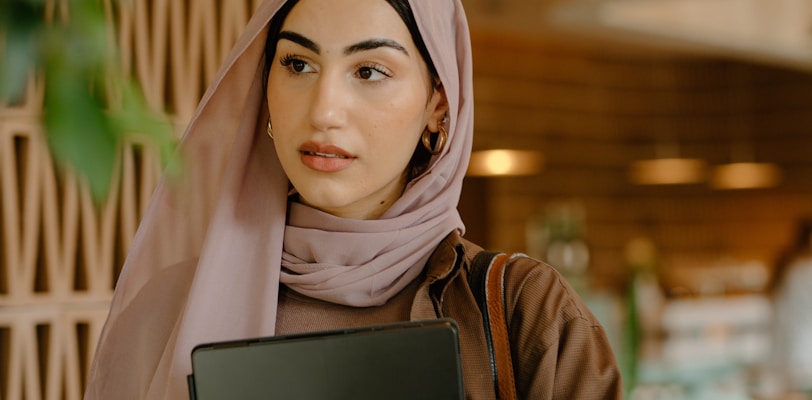 a person holding a laptop