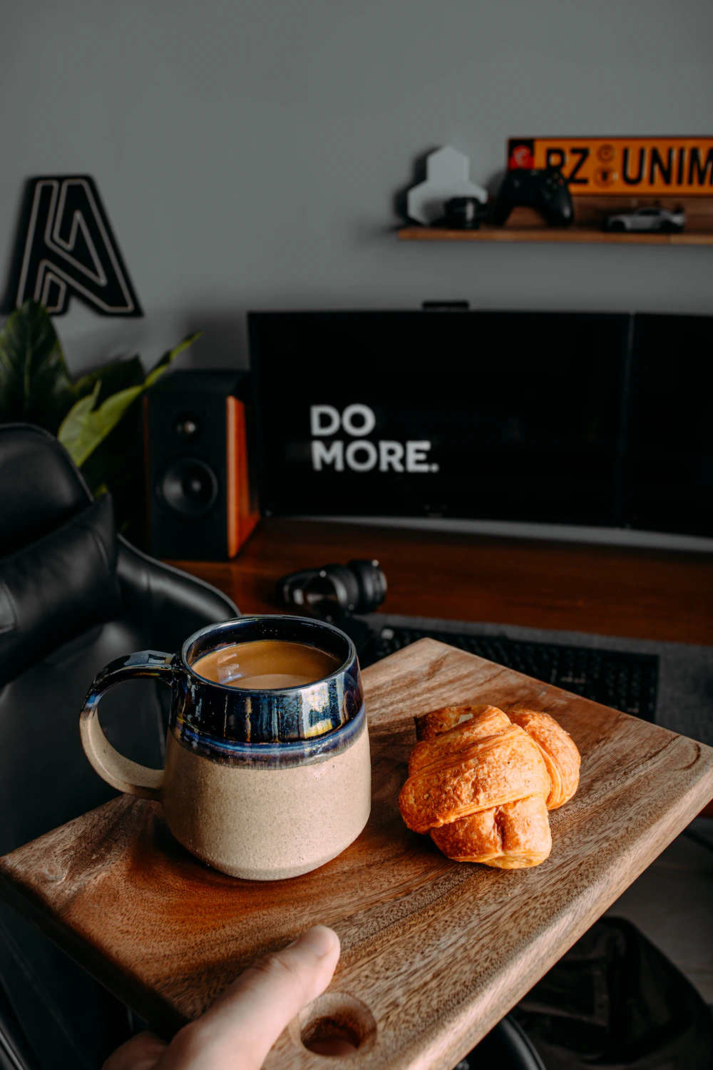 Coffee and a cookie beside a laptop keyboard