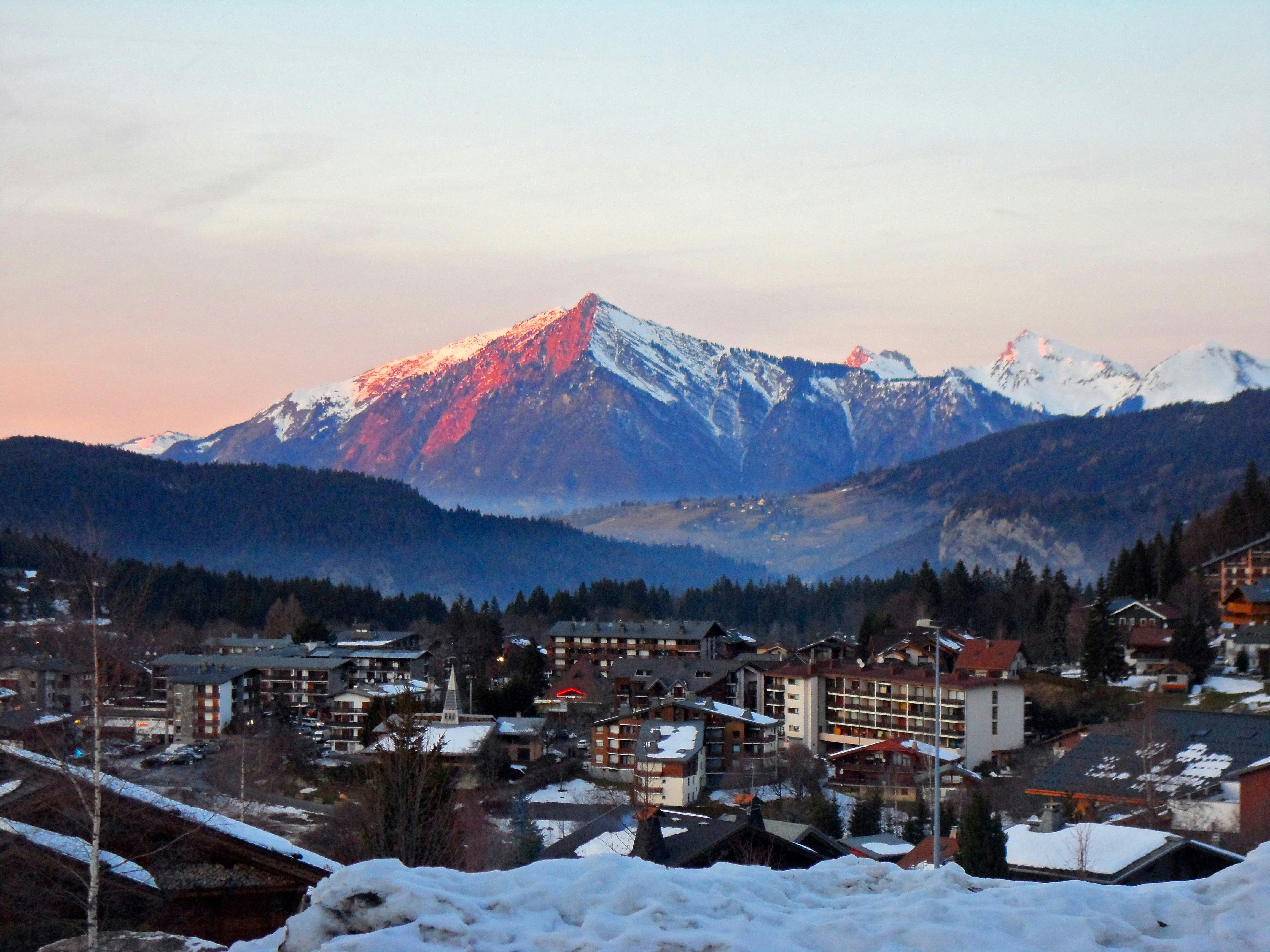 a town with snow covered mountains