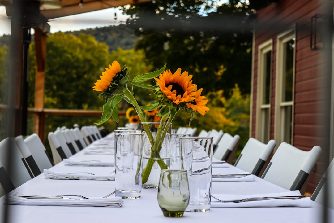 a table with a vase of flowers,