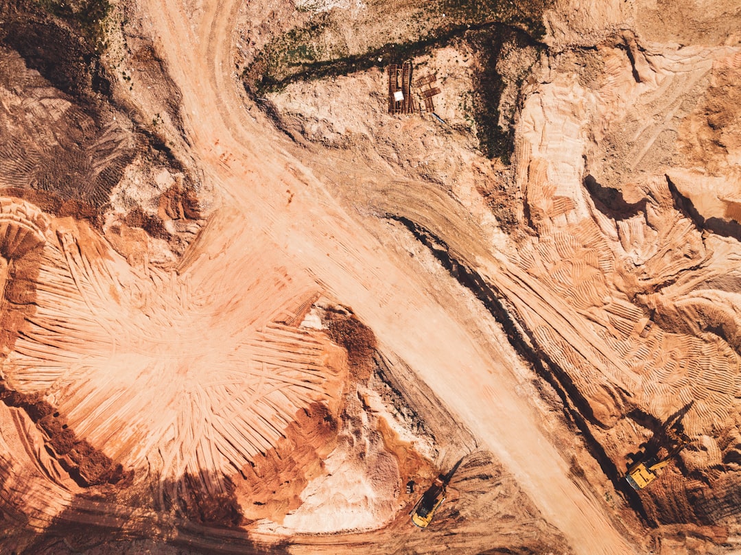 a large red rock formation, sand quarry