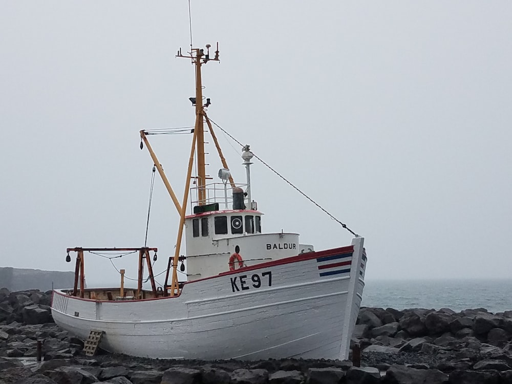 a boat on a rocky beach