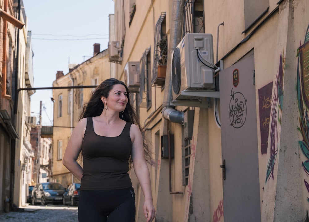 a woman walking down a street