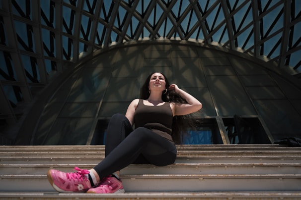 a woman sitting on a bench