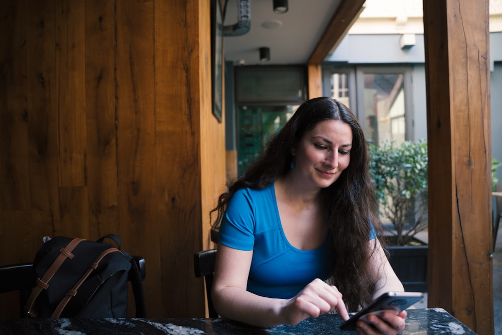 a woman sitting at a table