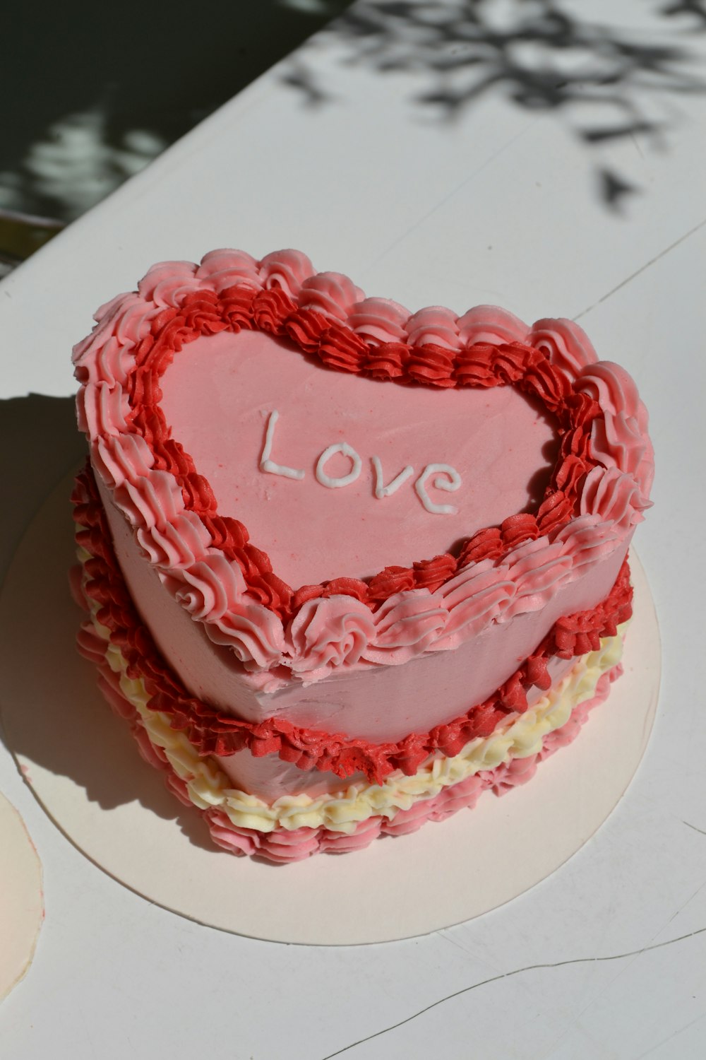 a cake with a red frosting