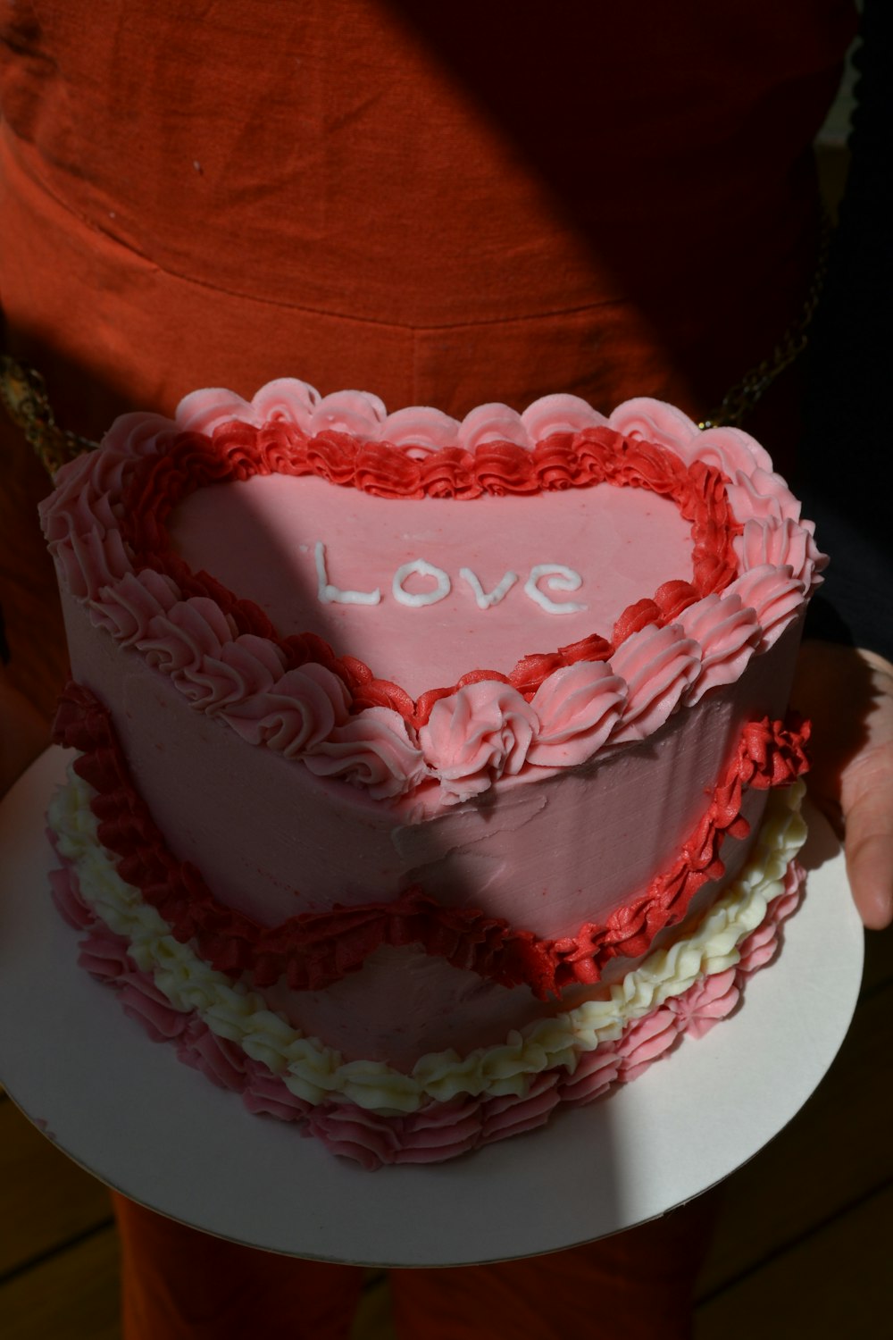 a cake with a pink frosting