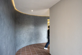 a person walking down a hallway