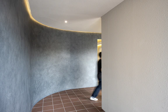 a person walking down a hallway