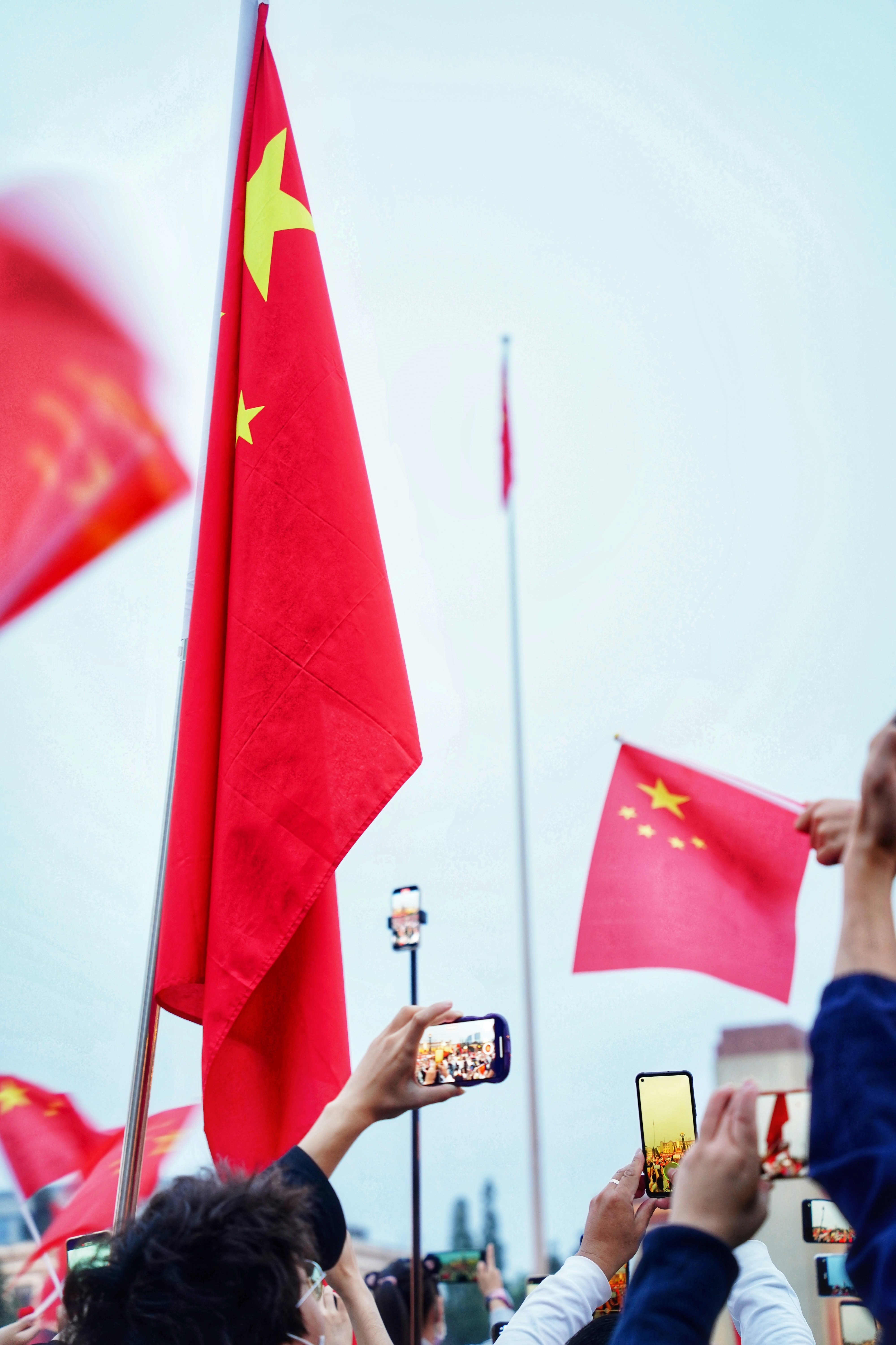 a group of people holding flags