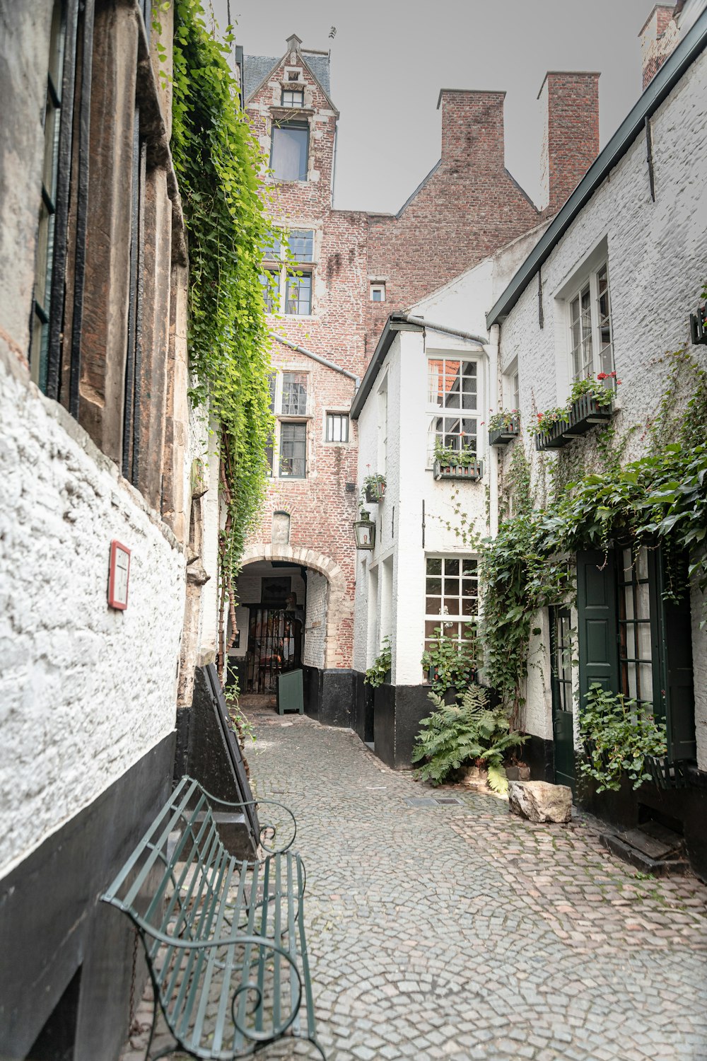 a stone street between buildings