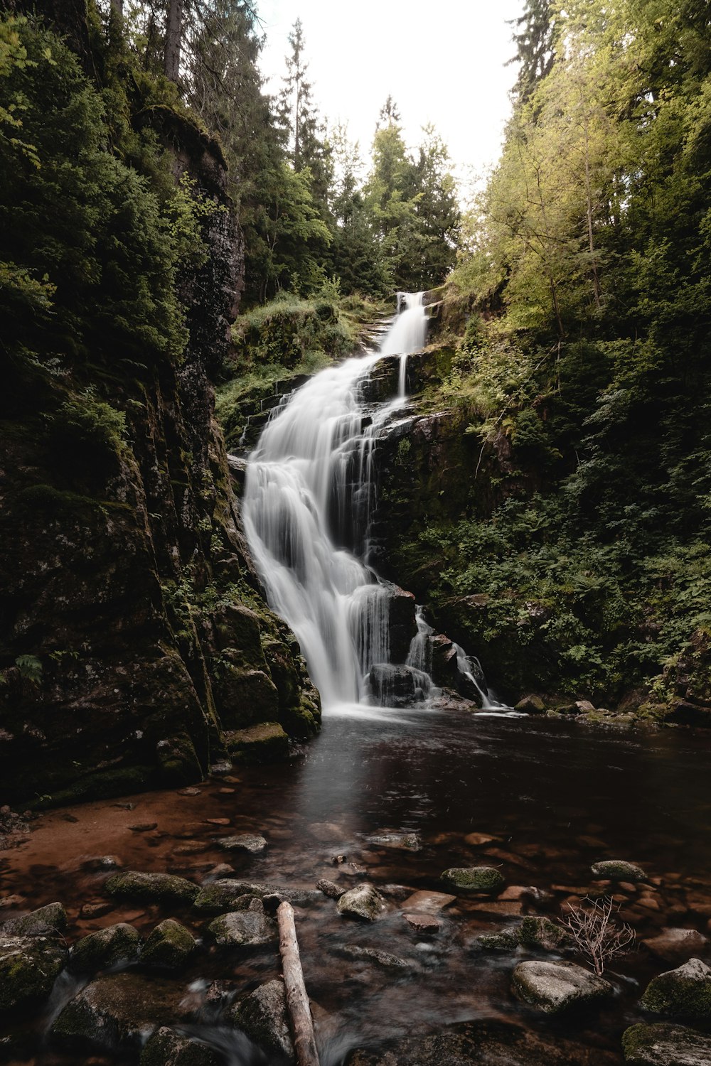 a waterfall in a forest