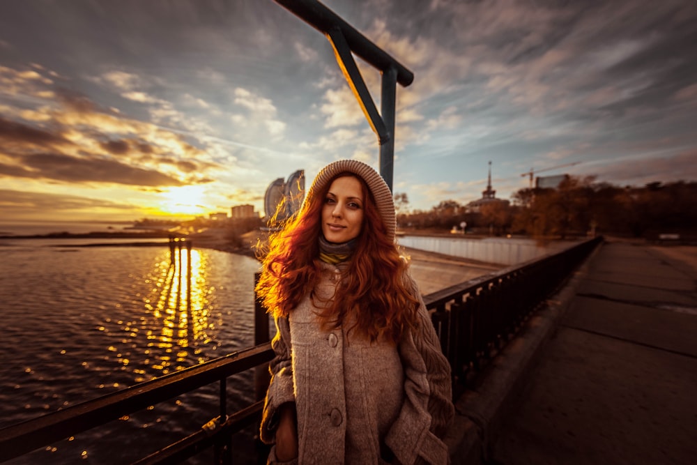 a woman standing on a dock