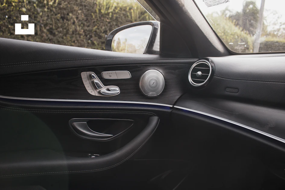 A car dashboard with a couple of round silver knobs photo – Free Grey ...