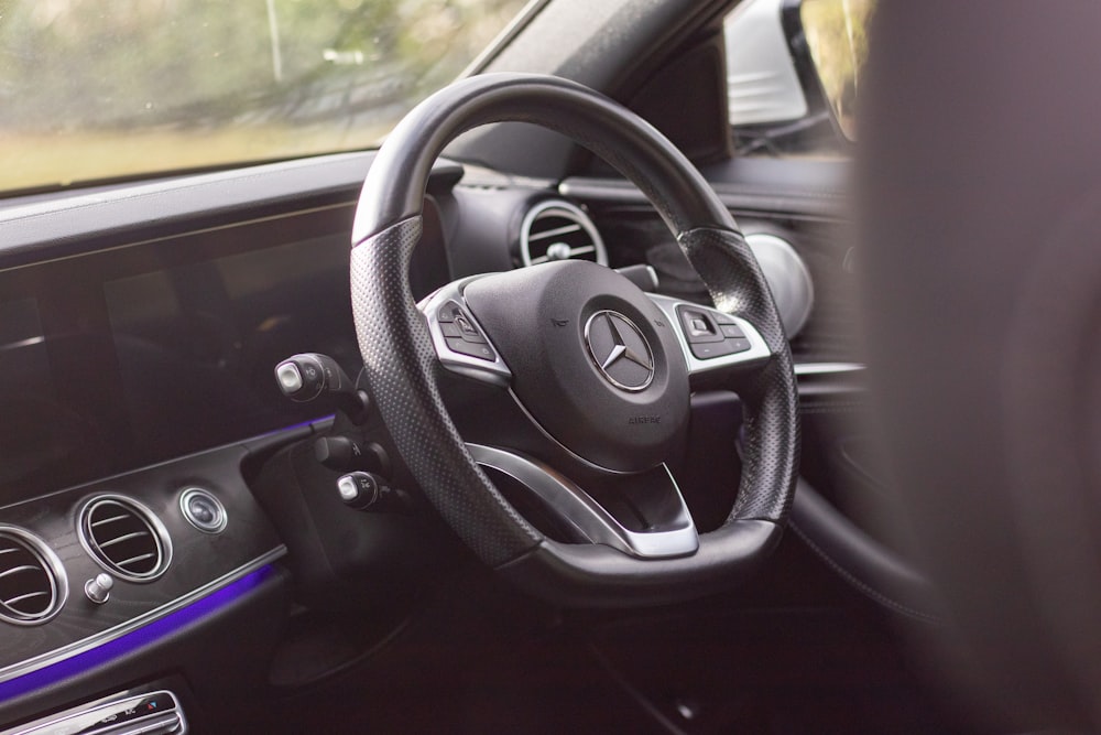 the steering wheel and dashboard of a car