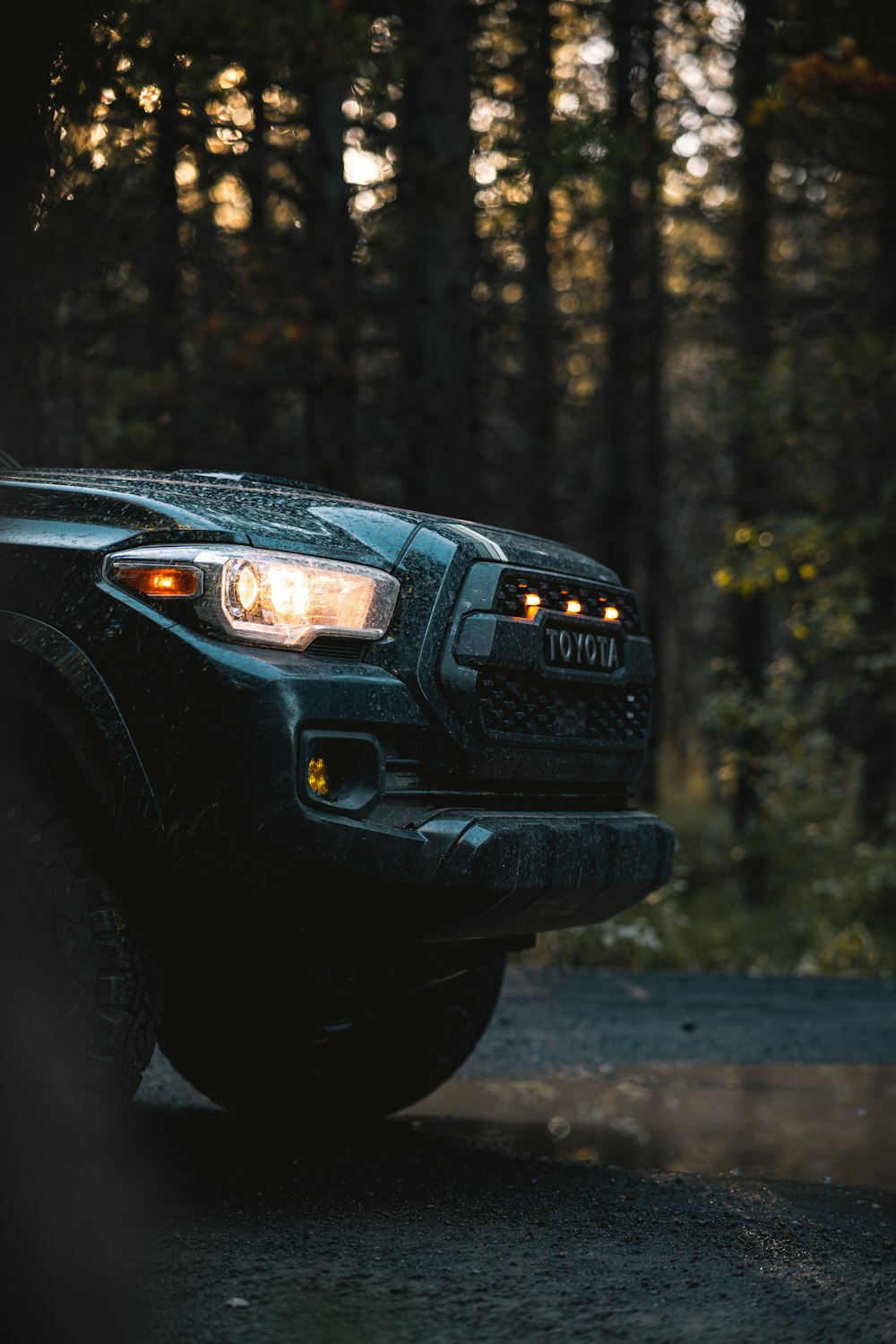 a black car with its lights on