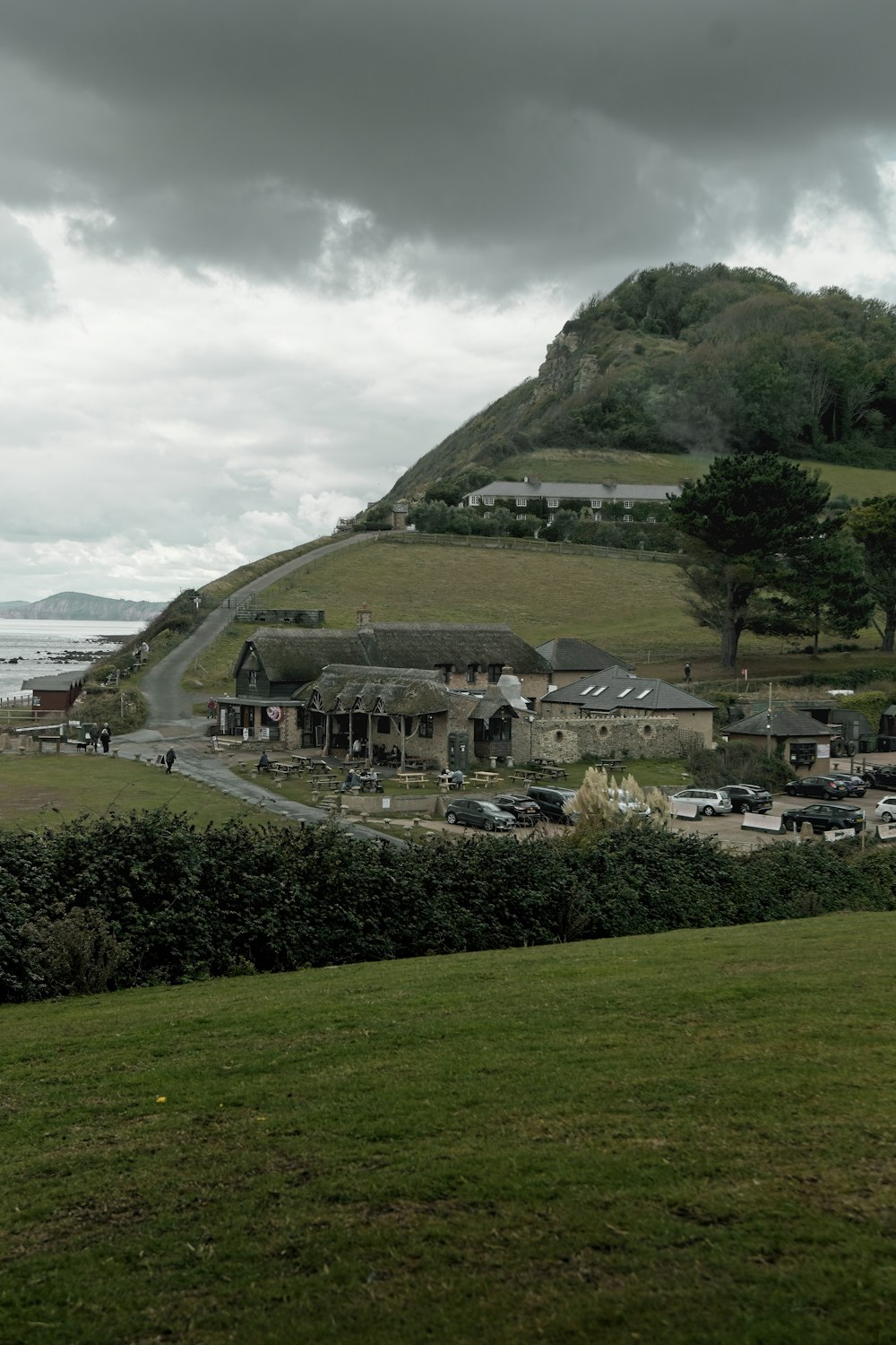 a building with a hill in the background