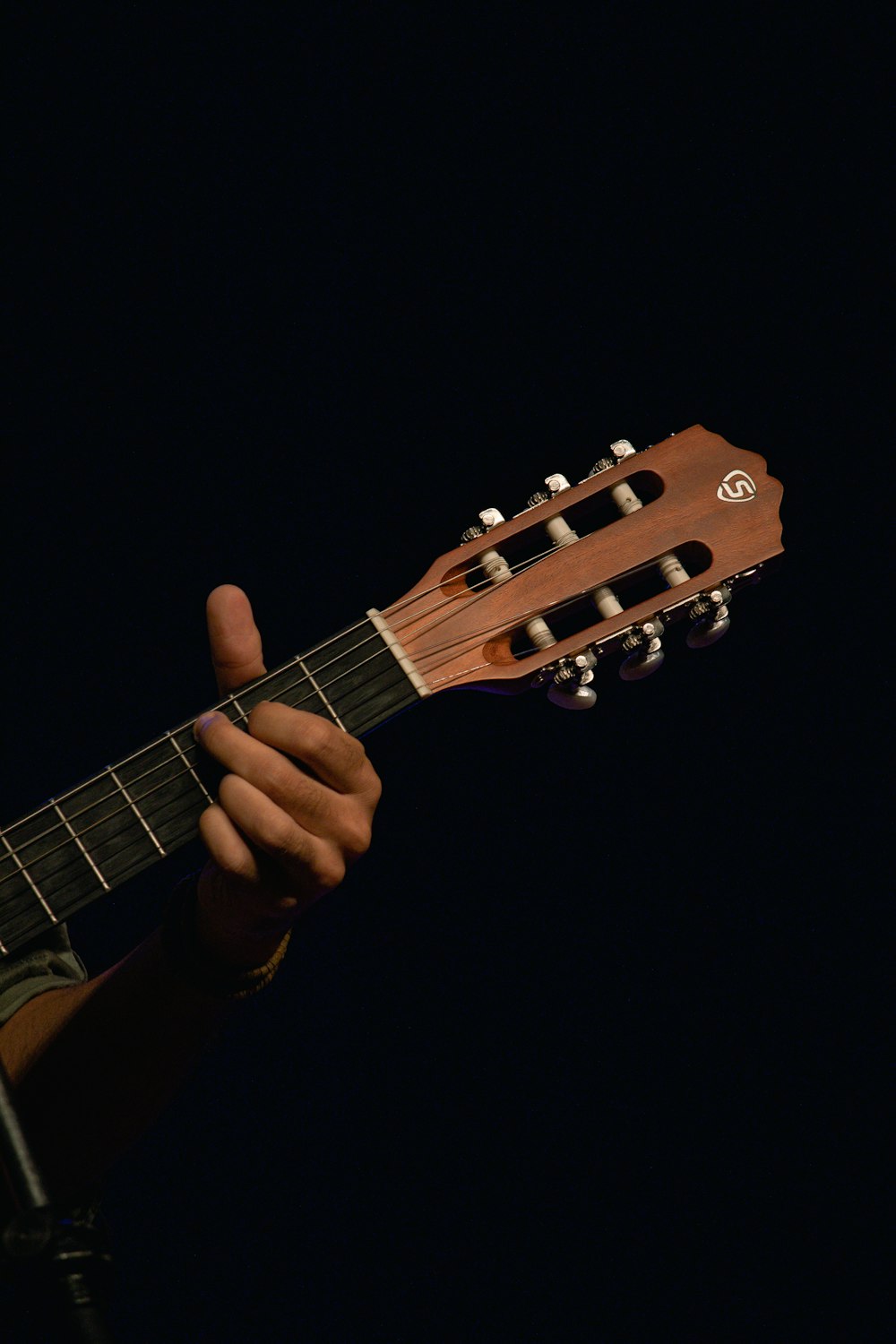 a person holding a guitar