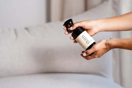 a person holding a bottle