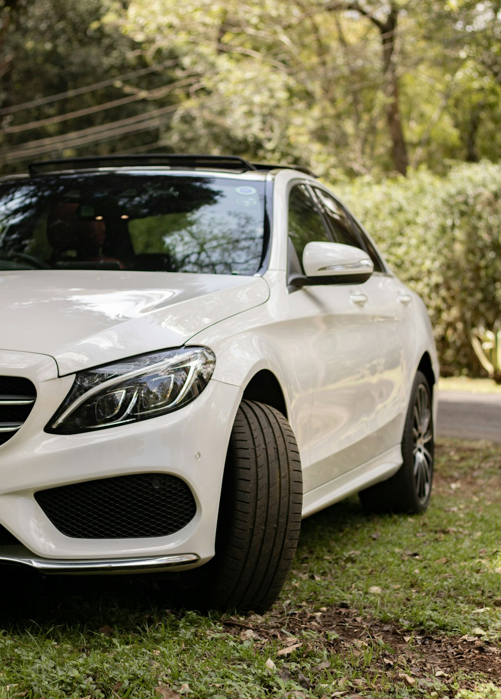 a white car parked on grass