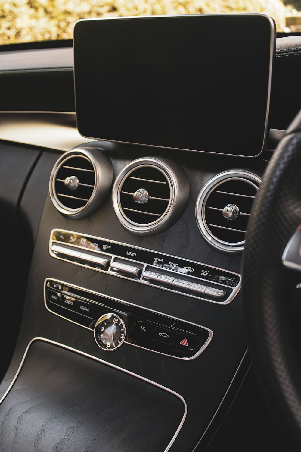 a car dashboard with a black speaker