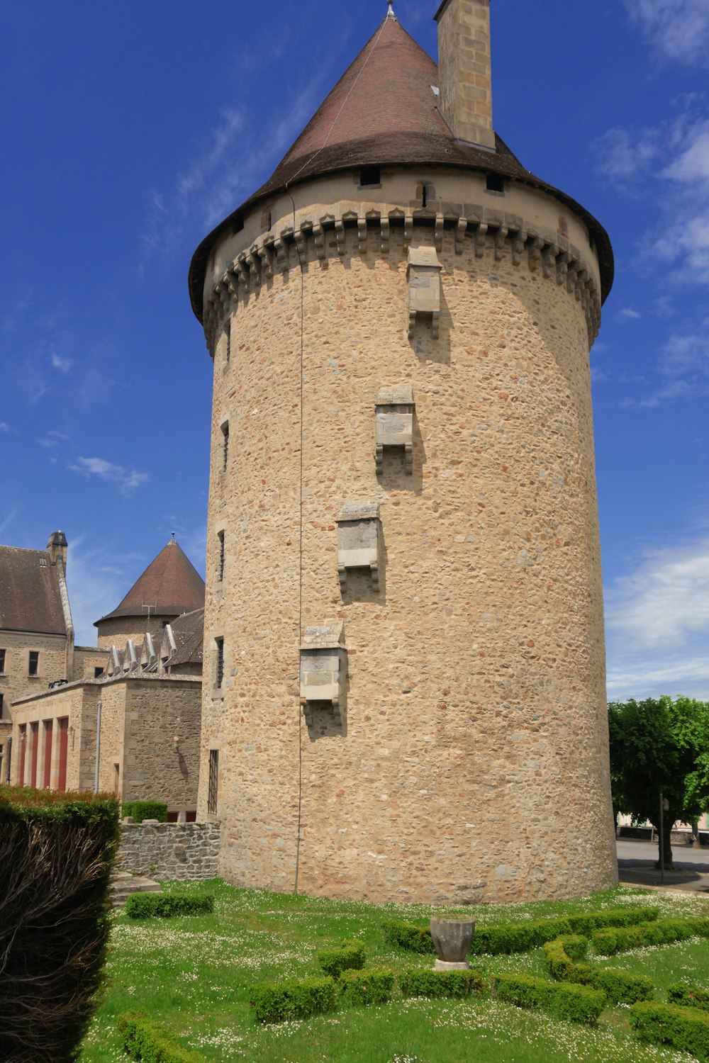 a stone tower with a pointed top