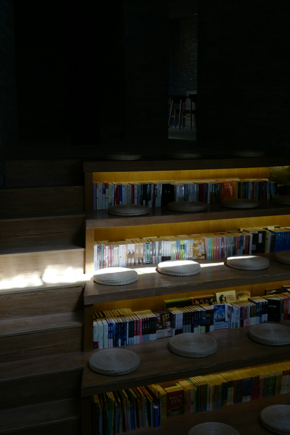 a shelf with books and plates