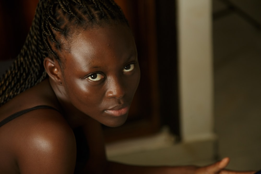 a young girl looking at the camera