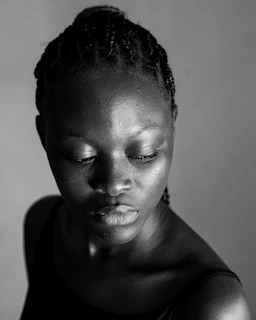 a black and white photo of a man with his eyes closed