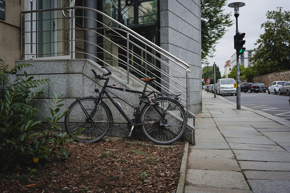 a bicycle parked on the side of a street