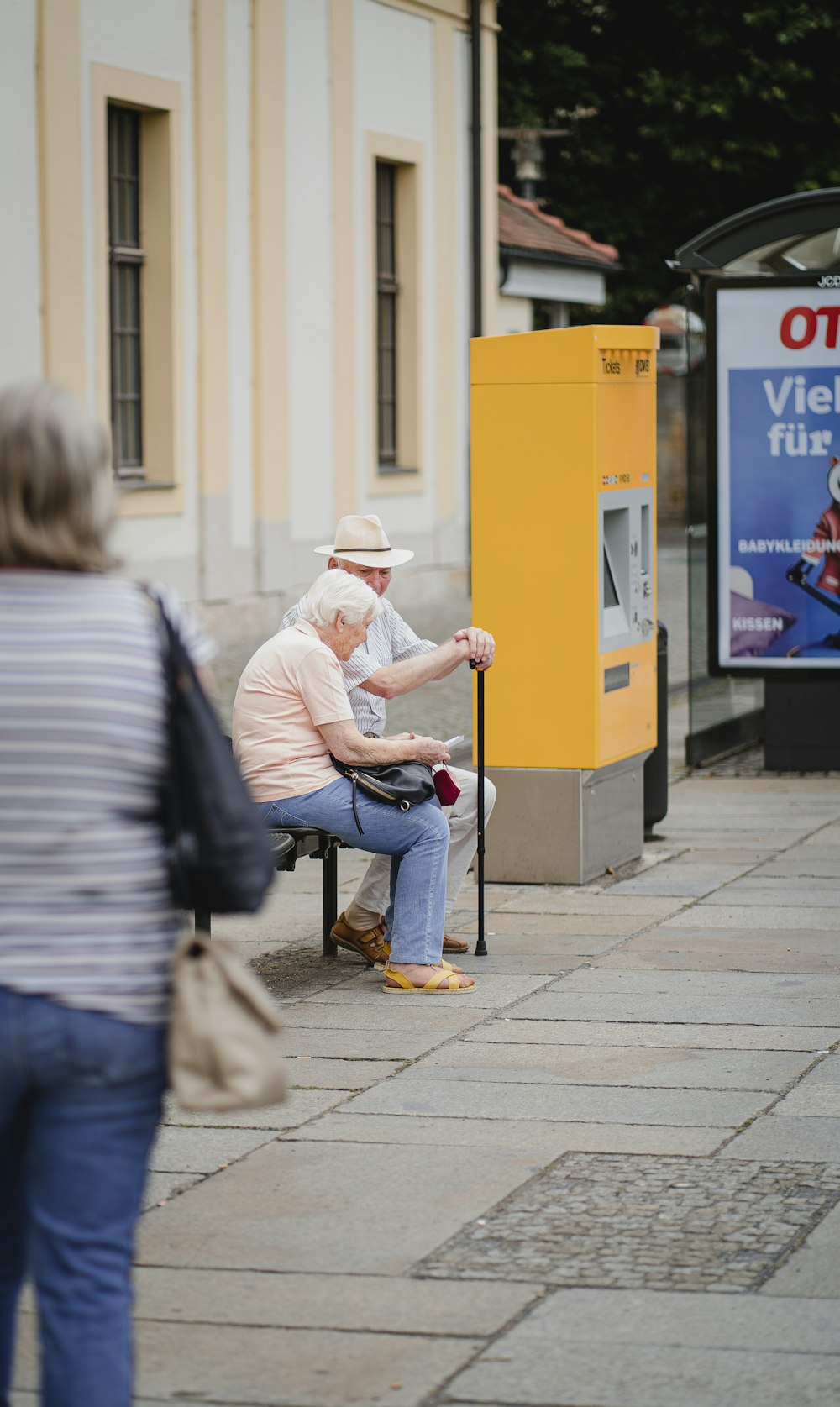 a person sitting on a stool