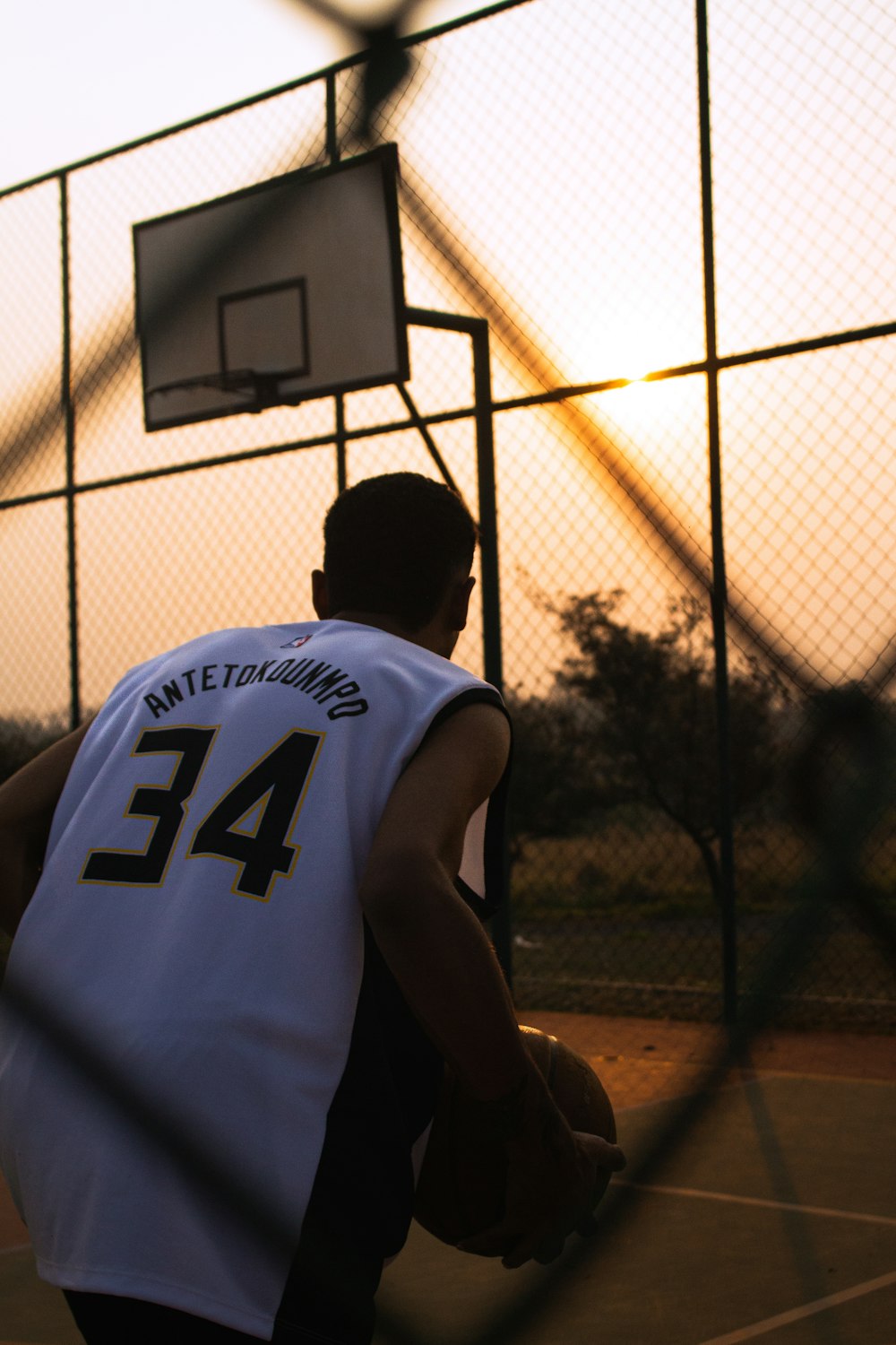 a person holding a basketball