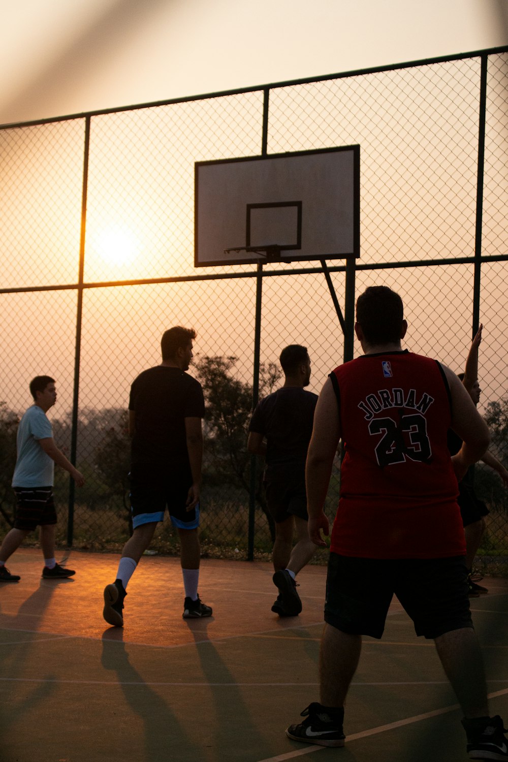 a group of people playing basketball