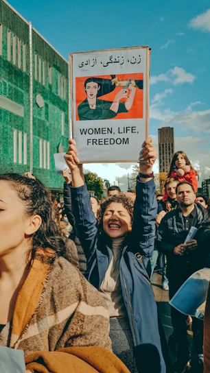 a group of people holding a sign