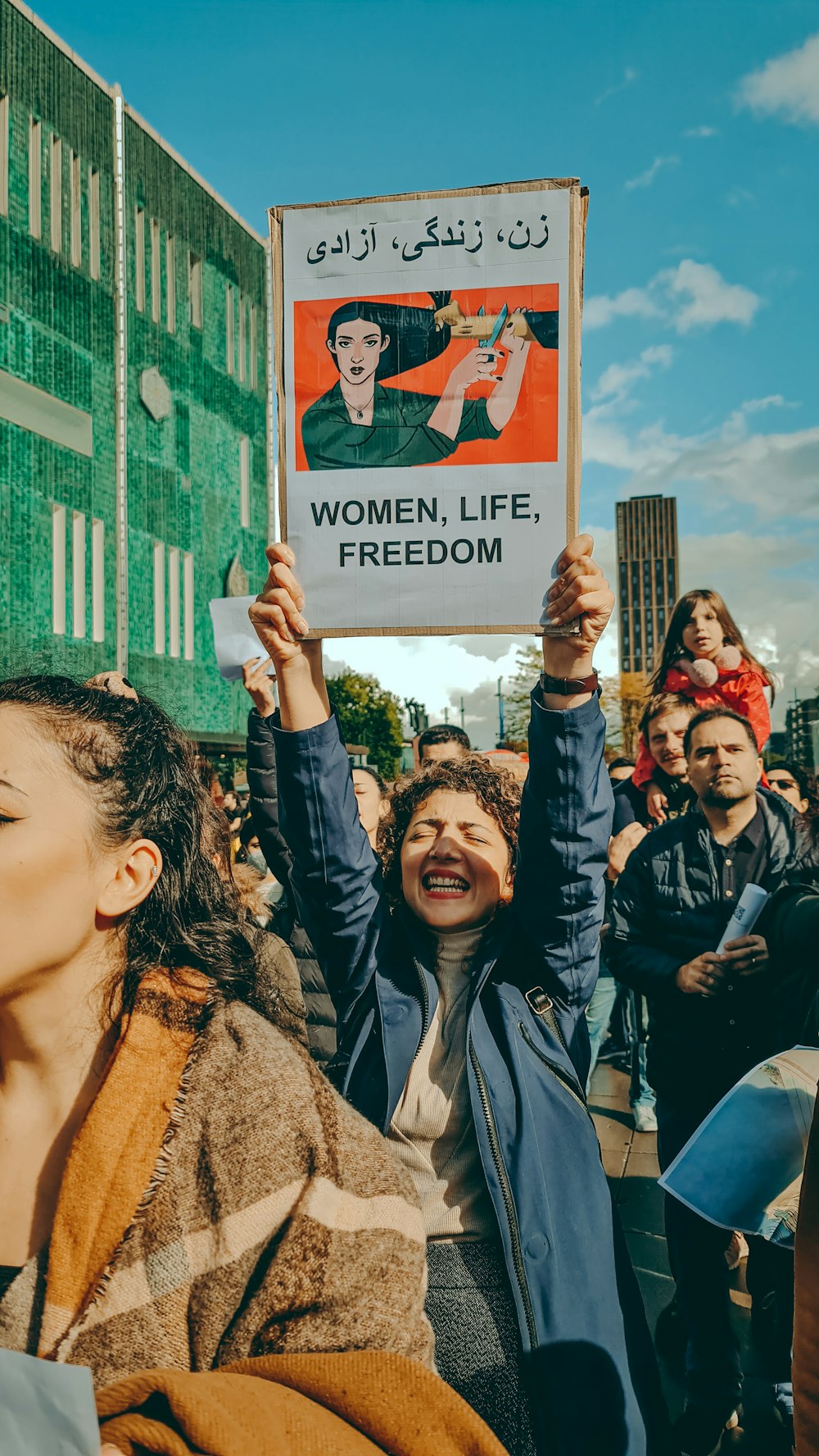 a group of people holding a sign