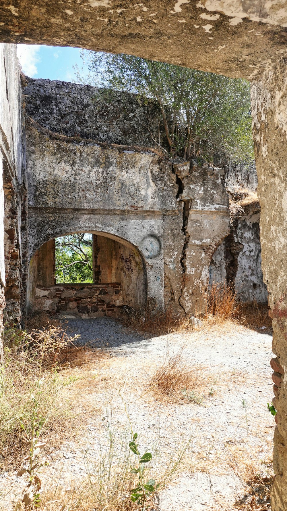 a stone archway with a window