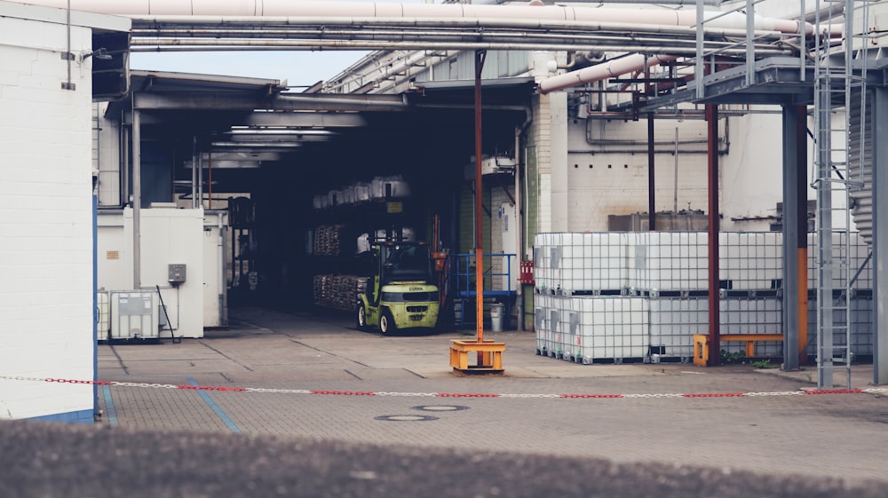 a large warehouse with a yellow truck