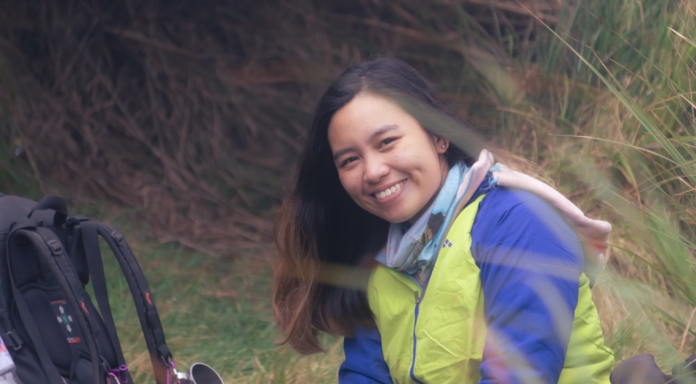 a person smiling with a backpack