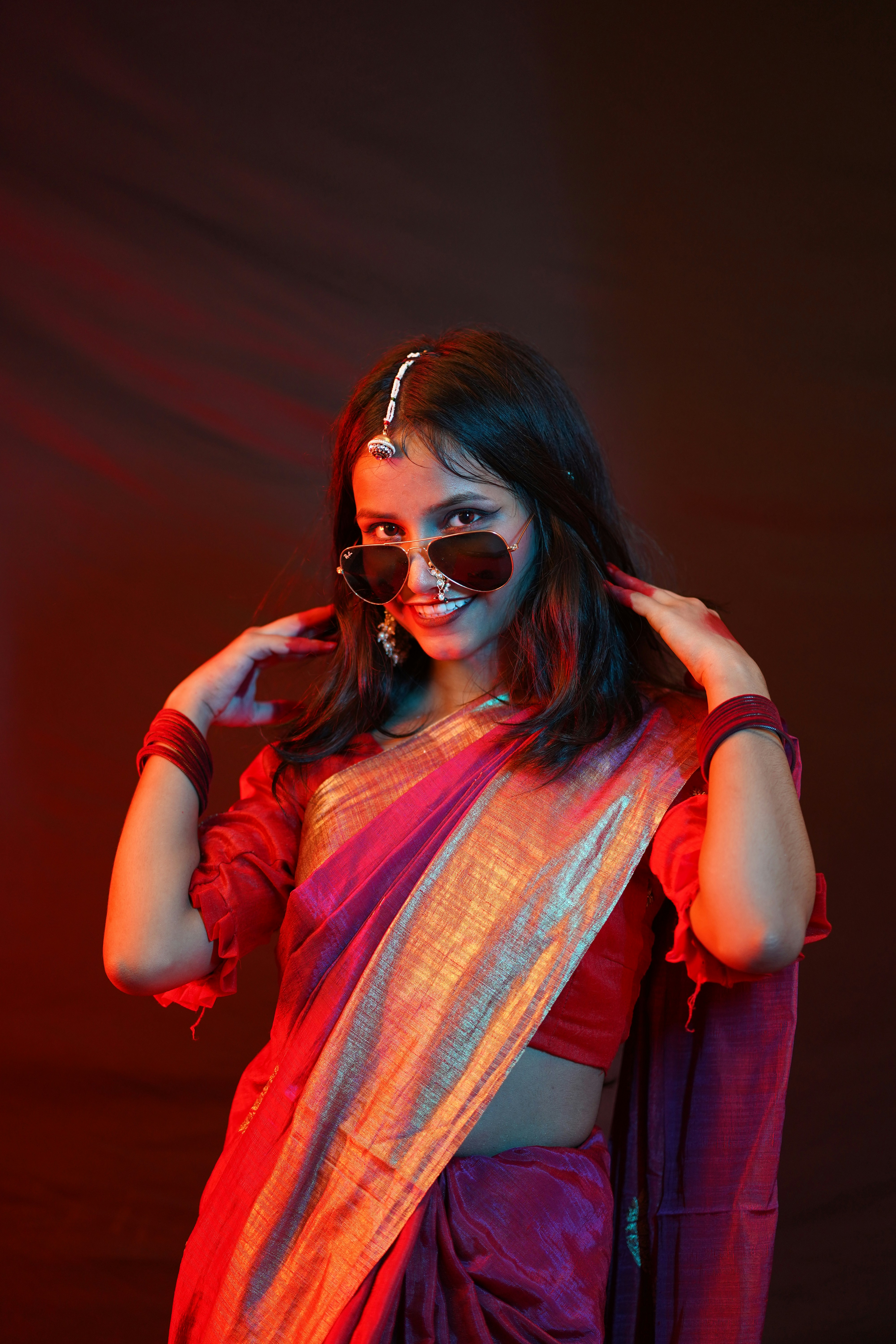 a woman with red hair and glasses