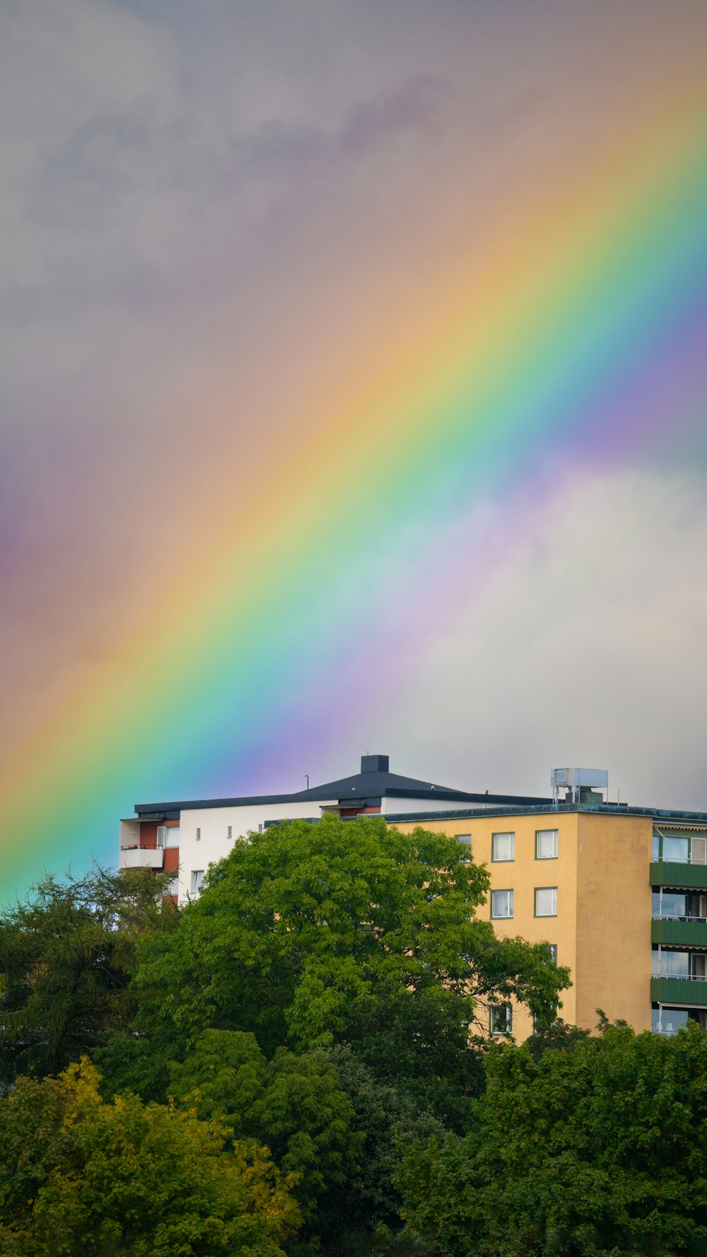 a rainbow over a building